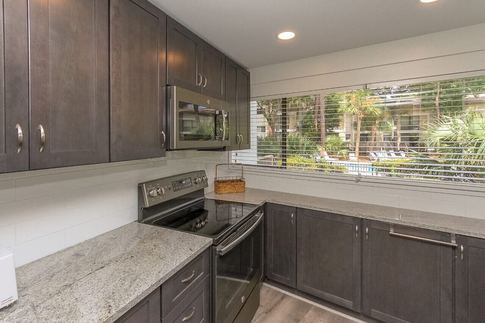 Kitchen - • Kitchen : Coffee Maker, Cookware, Full Kitchen, Microwave, Refrigerator, Dishwasher, Stove
