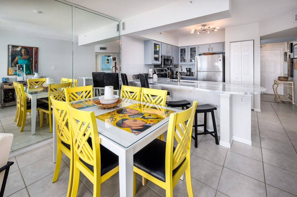 Dining area - The yellow chairs really add a unique POP accent to this open area!