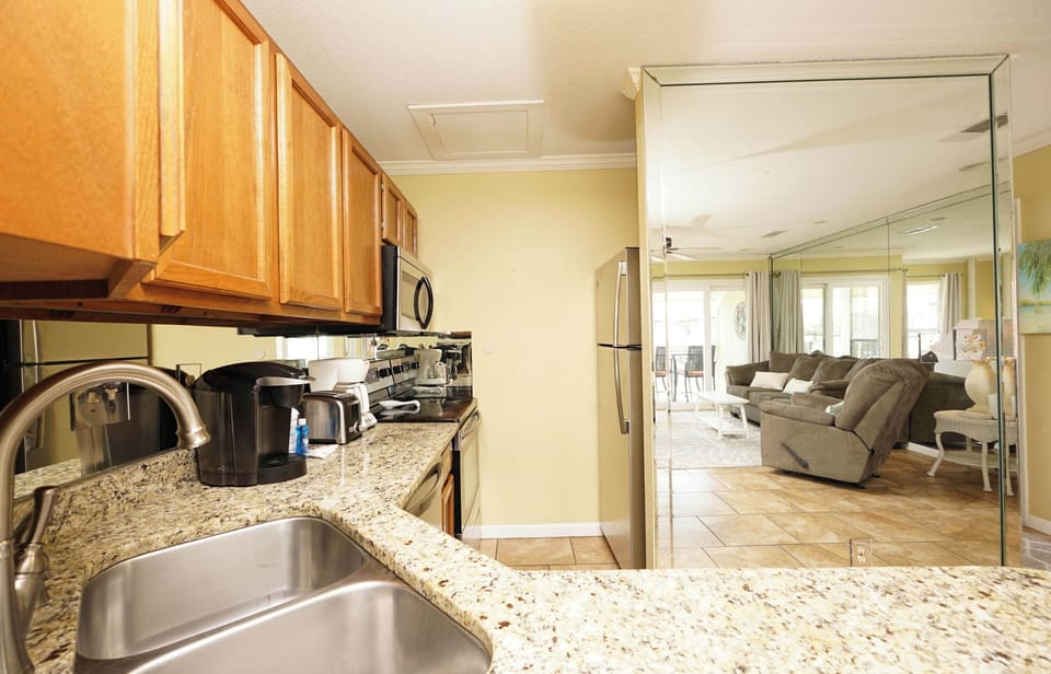 Your fully-equipped kitchen flows seamlessly into the bright living space, perfect for preparing meals while staying connected with loved ones.