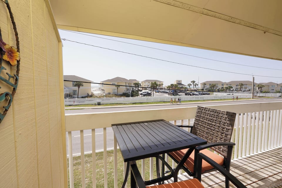 Your covered balcony offers a peaceful spot to enjoy morning coffee while watching the quiet neighborhood come alive.