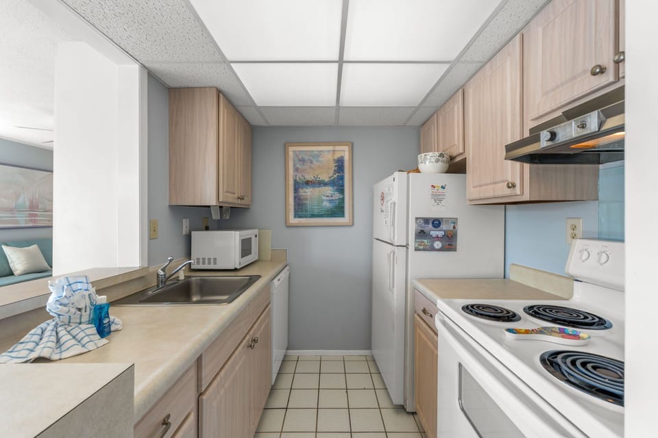 A well-equipped galley kitchen with everything you need to whip up your favorite meals—complete with full-size appliances, ample counter space, and plenty of storage.