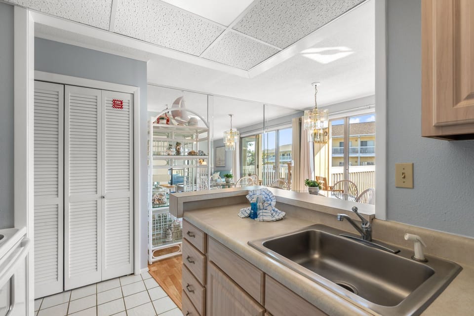 Step into your bright, open kitchen with charming pass-through window to the elegant dining space—perfect for effortless hosting and enjoying meals with loved ones.