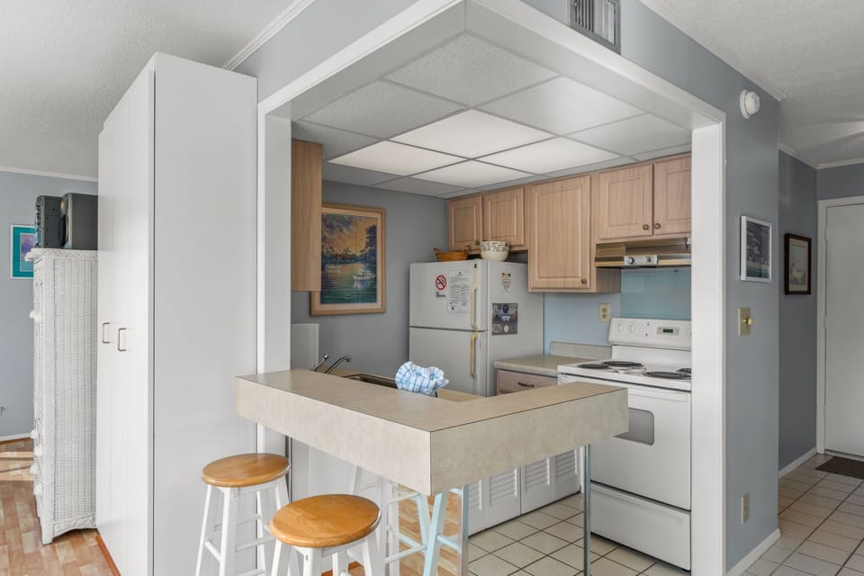 Your fully-equipped kitchen features a breakfast bar with cozy seating, perfect for casual meals and morning coffee as you plan your day's adventures.