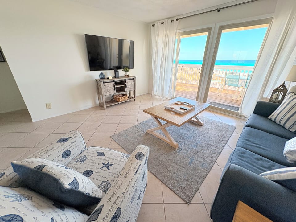 Your oceanfront living room opens directly to the sea, where you'll unwind with pristine beach views stretching endlessly beyond your private balcony.