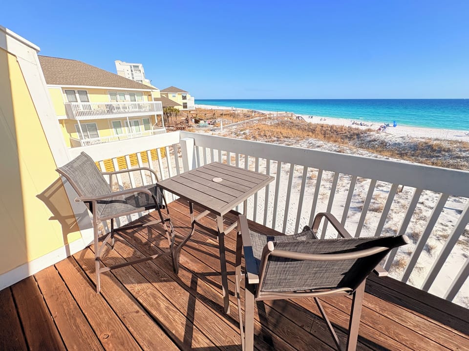 Sip your morning coffee on this private beachfront balcony while watching the waves roll in. The perfect spot to unwind.