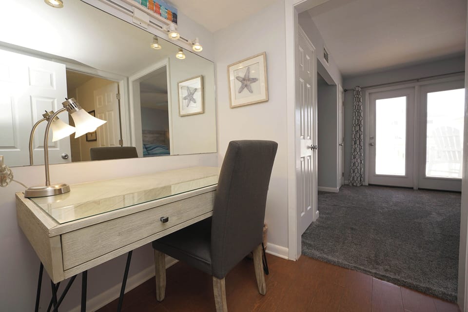 Your dedicated workspace features a stylish desk with warm lighting, perfectly positioned for productive mornings or peaceful planning sessions.