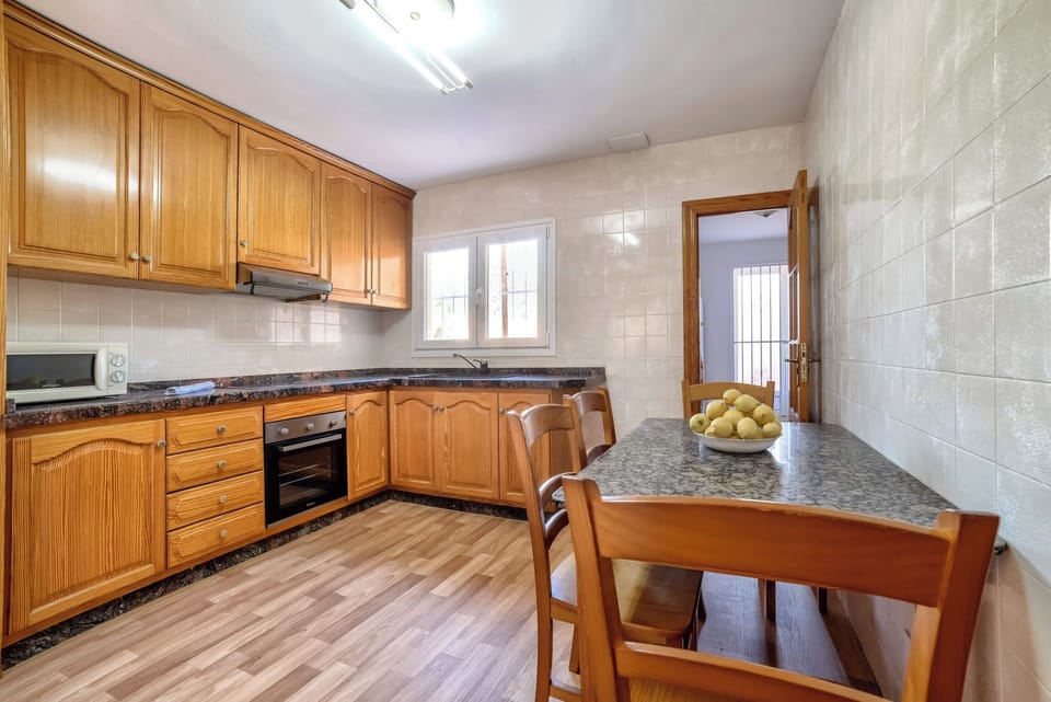 Holiday villa with private pool located in Calpe (Costa Blanca) for 8 people, with four bedrooms and three bathrooms distributed over two floors.INTERIOR: The GROUND FLOOR is closed and uninhabited during the rental. THE HIGH FLOOR: It is accessed by external stairs through the covered terrace with access to the large dining room and living room with SAT / tdt TV. It also has a separate kitchen with fully equipped gas fires. A room with a washing machine. There are two large bedrooms with 2 single beds each. A separate bathroom with shower. And two large bedrooms with a double bed each. Apart there is a toilet. The living room and all bedrooms are equipped with air conditioning.EXTERIOR: Nice 8x4 pool (1m min. and 1.70m max.) area with Roman stairs, covered construction barbecue and an outdoor shower. There is also a bathroom with shower. Parking on the plot for 2 vehicles.LOCATION: The villa is located in a privileged area called "Benicolada" near the center of Calpe 600 m as well as the sandy beach 1.3 km. The nearest supermarket is only 600 meters from the house.OBSERVATION: Free WiFi. Pets are allowed up to 12 kg with supplement.