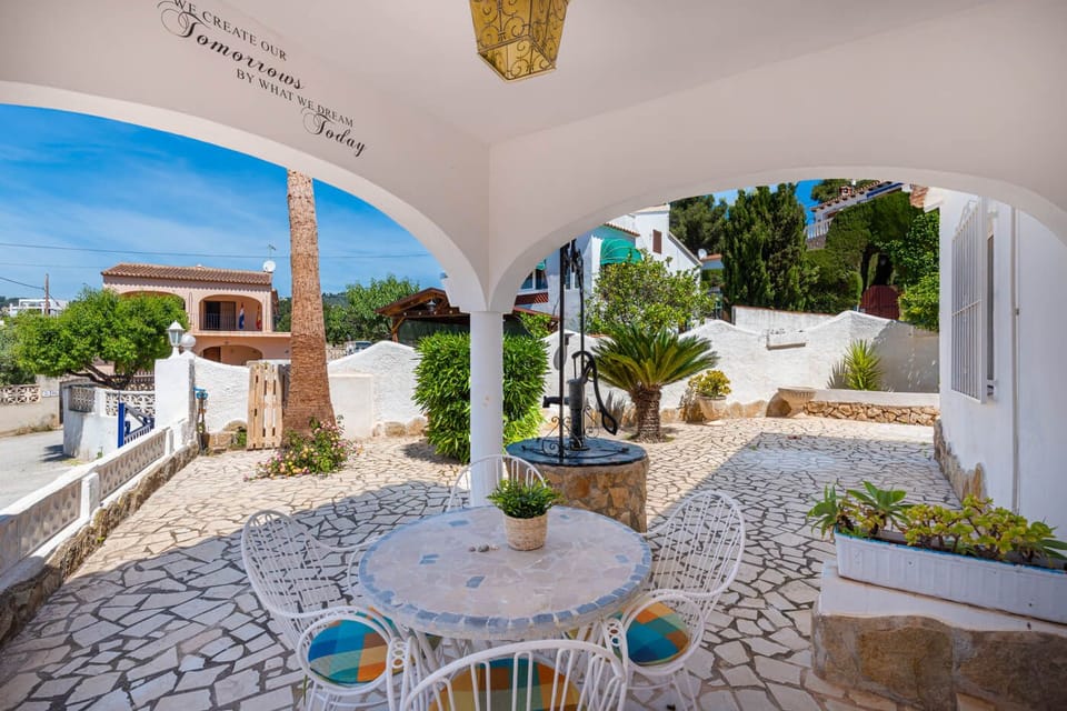 Pleasant fully renovated holiday villa, with private pool located in Benissa-Costa (Costa Blanca) for 8 people. This charming villa has three bedrooms and two bathrooms, all of them distributed on one floor for greater comfort.Inside the villa, you will find a comfortable living-dining room with air conditioning and access to an equipped kitchen, where you can prepare your meals with ease. In addition, there are three bedrooms, two with a double bed and another with two single beds, all of them equipped with air conditioning to guarantee a cool and pleasant stay. You will also find a second living room that can be converted into an additional bedroom thanks to its sofa bed. The villa has two bathrooms with a shower, one of them en suite.Outside the villa, you will find a pleasant plot where you will find a kidney-shaped swimming pool with Roman stairs and outdoor shower, ideal for relaxing and enjoying your holiday. In addition, there is a pleasant solarium where you can enjoy views of the mountains and the sea.The villa is located in a privileged urbanization, close to LA FUSTERA beach and a supermarket (0.5 km), as well as the center of Calpe and all services (4 km).Some additional observations about the villa include the availability of free wifi and that pets are not allowed.Do not hesitate to book this pleasant villa to enjoy an unforgettable holiday in Benissa-Costa.