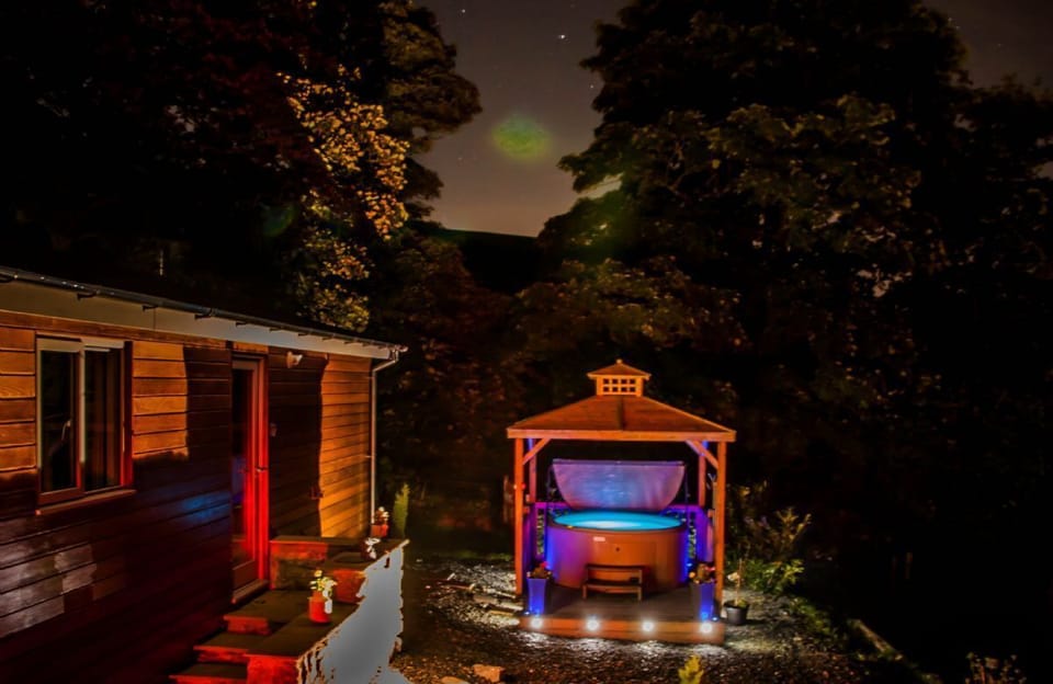 The hot tub by night with atmospheric lighting