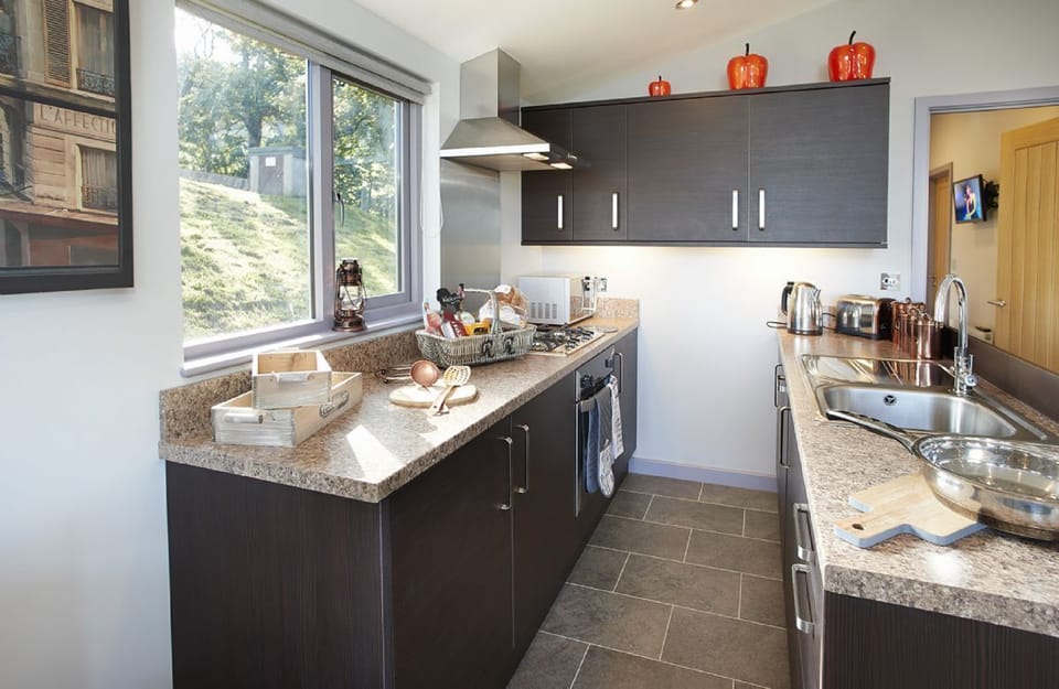 En-suite shower room with twin wash basins and a generous walk-in shower