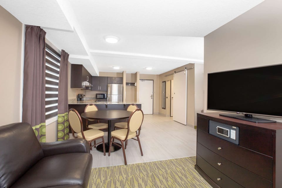 Room, 2 Queen Beds, Non Smoking (Deluxe Efficiency Room) | In-room safe, desk, blackout drapes, iron/ironing board