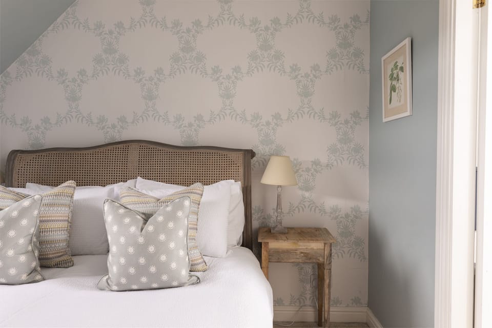 The Wheel House - bedroom one with king size bed and side tables