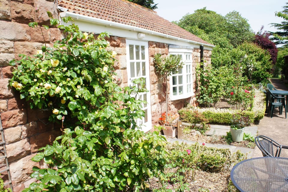 Rose Cottage beyond April Cottages door.