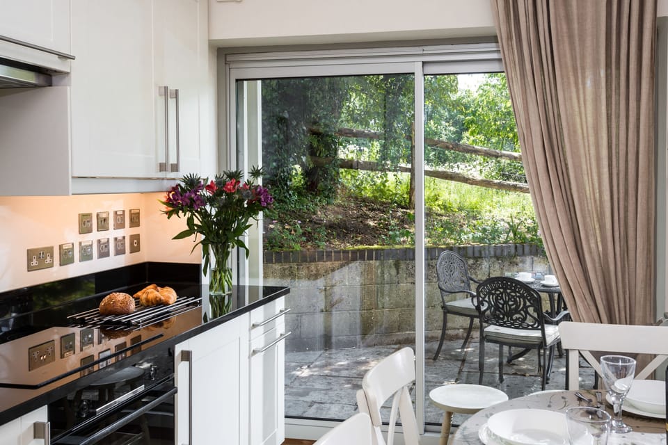 Sliding doors in the kitchen provide access to the patio where you can enjoy your morning coffee