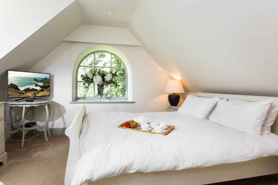 Enjoy a perfect nights sleep in bedroom one with a queen size bed