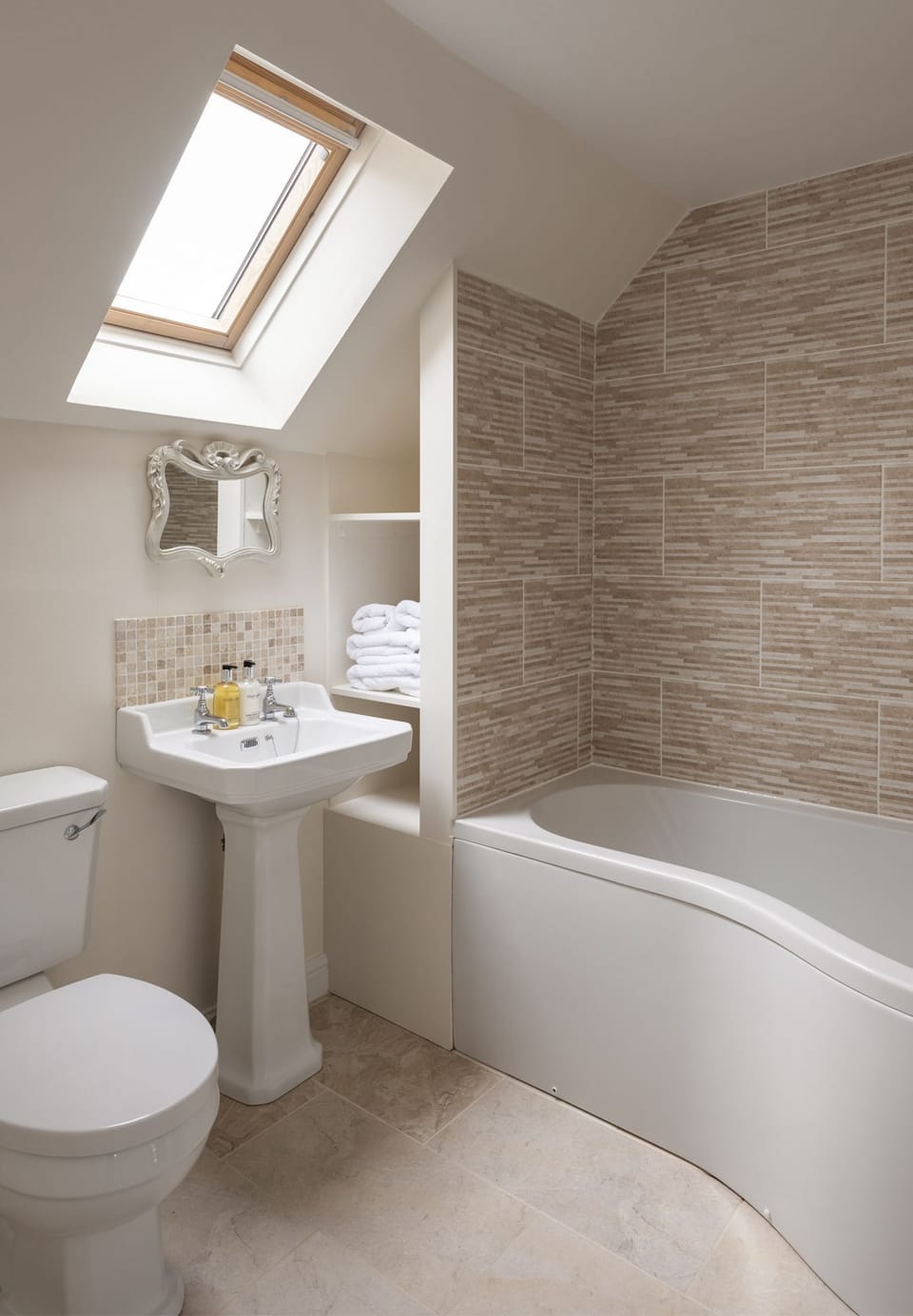 The Mill House - bedroom one ensuite bathroom with bath with shower over