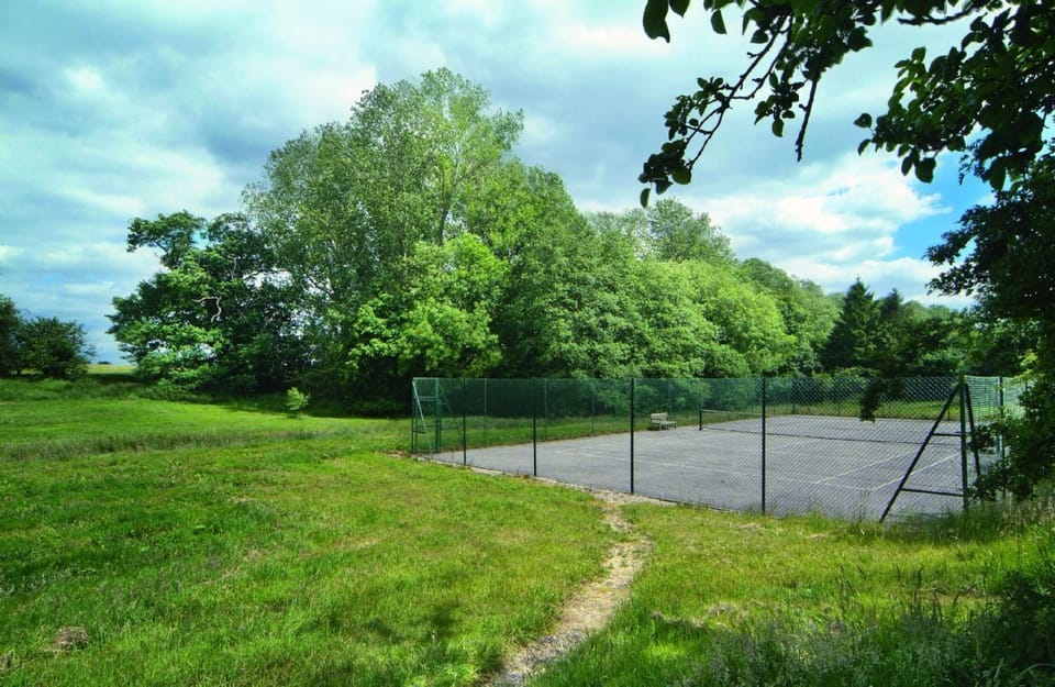 Use of an all weather tennis court in the grounds