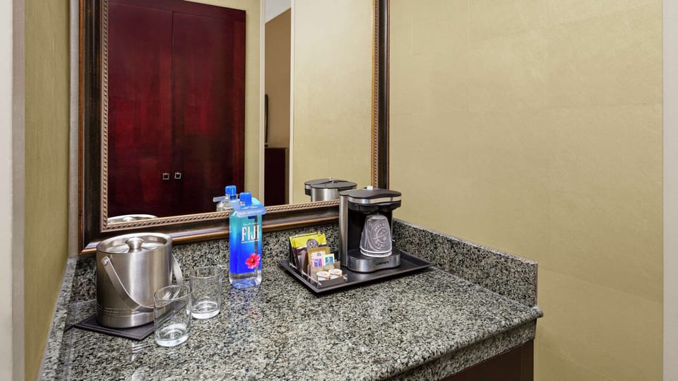 Down comforters, pillowtop beds, in-room safe, desk