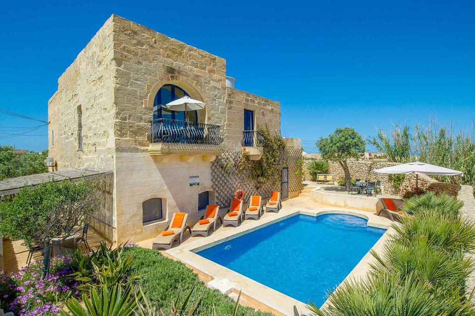 Pool area of Dar il-Bahar holiday villa in Gozo