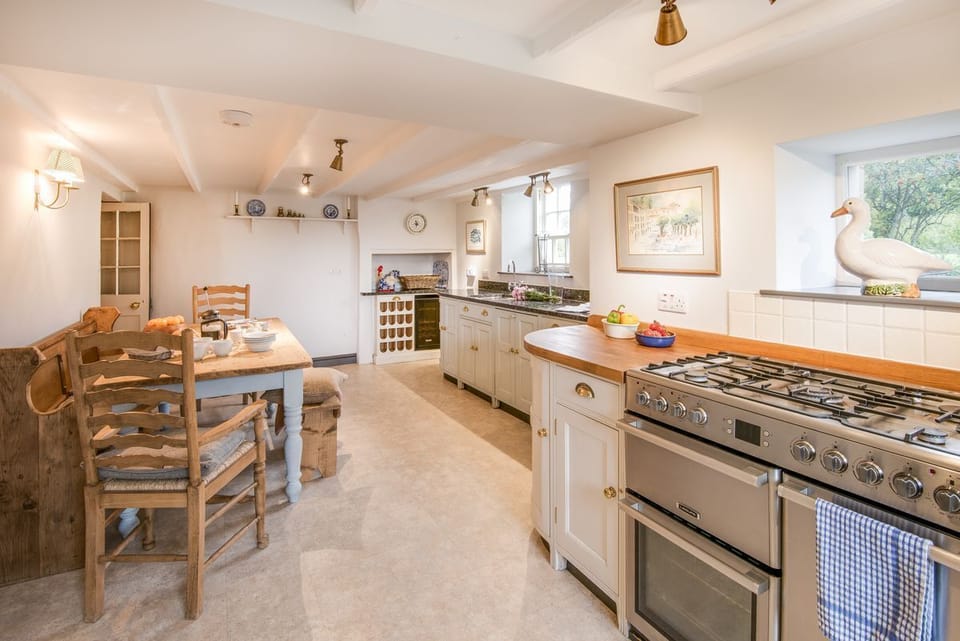 Abbey House - the bright kitchen with breakfast dining space - please note the cooker is now electric with a ceramic hob