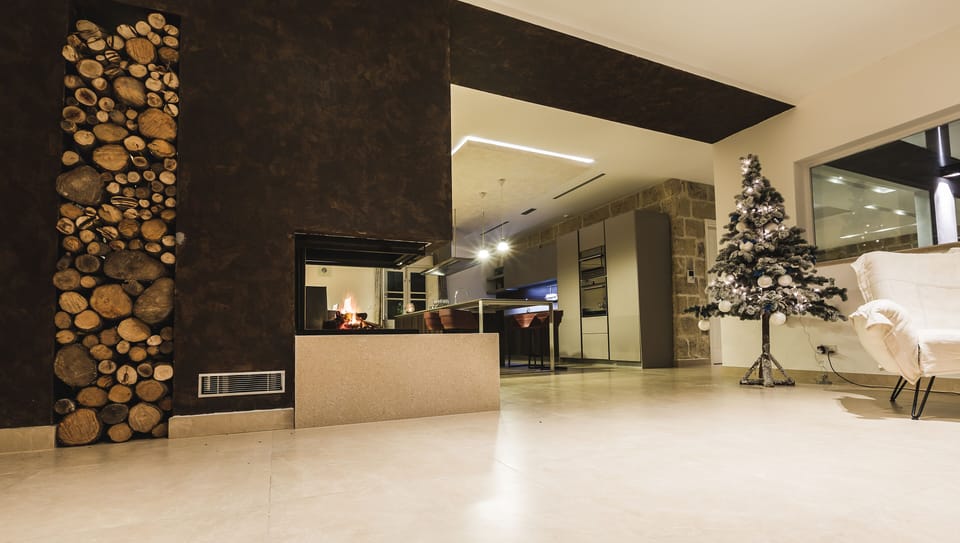 Hallway leading to the kitchen including a fireplace
