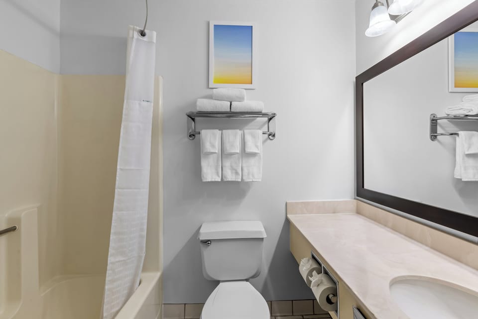 Combined shower/tub, deep soaking tub, free toiletries, hair dryer