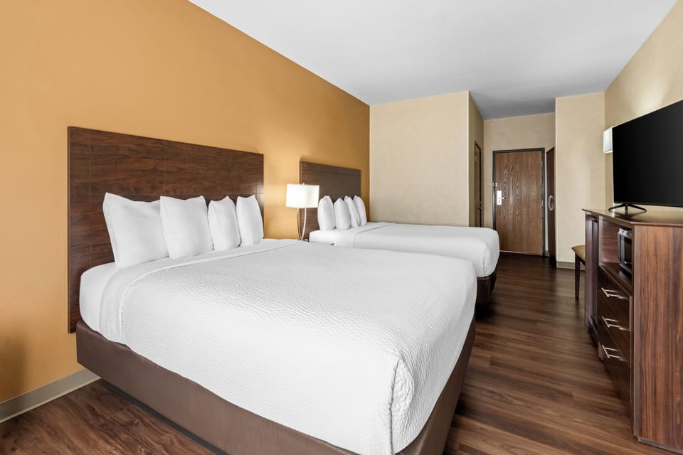 Standard Room, 2 Queen Beds | Desk, laptop workspace, blackout drapes, iron/ironing board