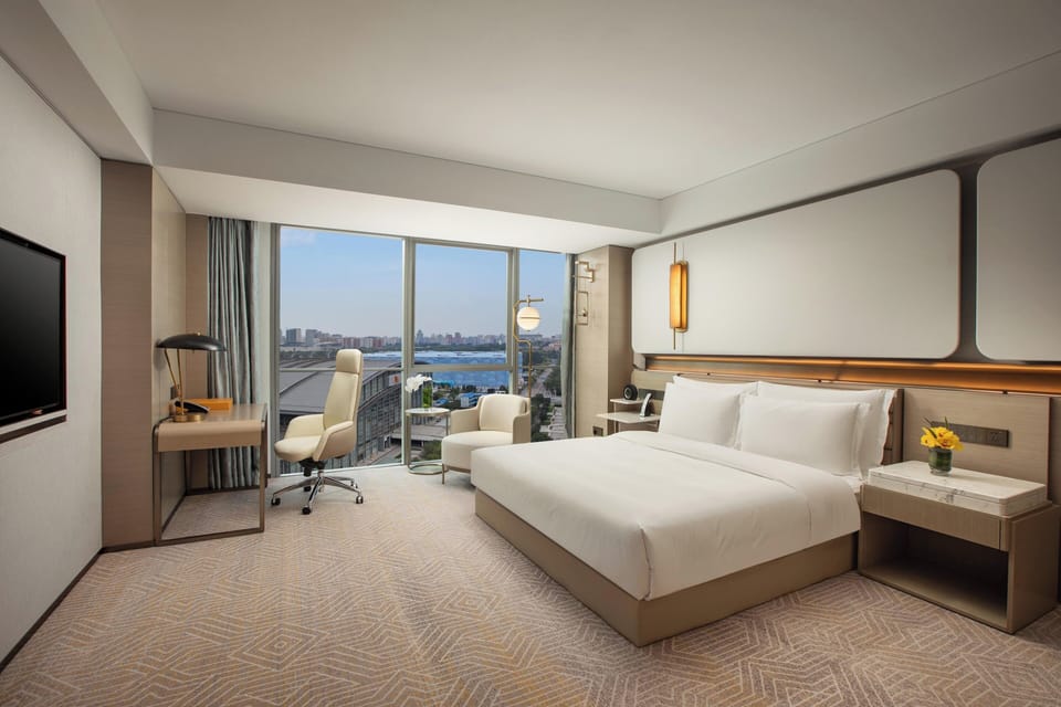Premium bedding, down comforters, pillowtop beds, minibar
