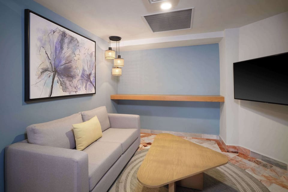 Executive Suite, 1 King Bed - Non-smoking | Living area | 50-inch Smart TV with cable channels, TV, first-run movies