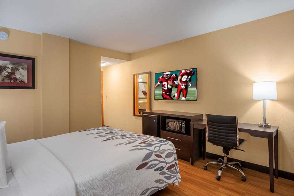 Desk, iron/ironing board, cribs (free), WiFi (free)