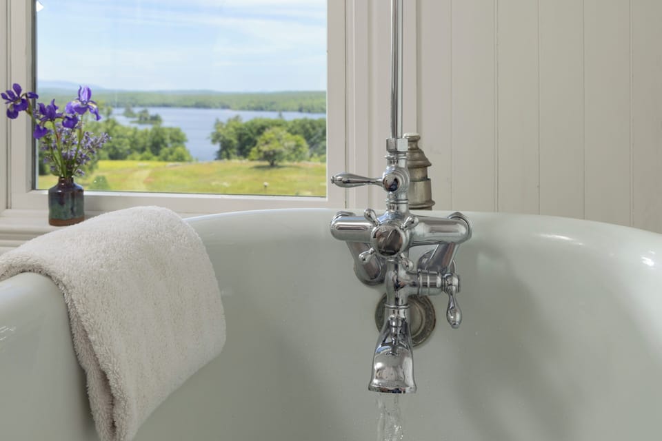 Deluxe Room, 1 Queen Bed, Private Bathroom (Rose Room) | Bathroom | Combined shower/tub, free toiletries, hair dryer, bathrobes
