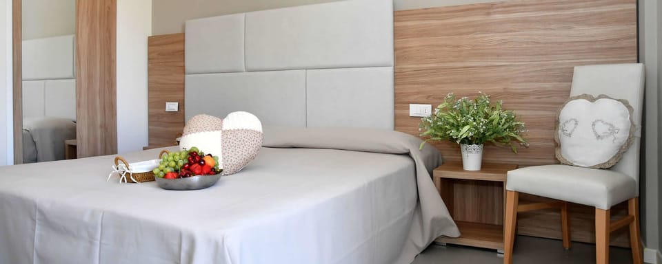Deluxe Quadruple Room | Premium bedding, desk, WiFi (free), bed sheets