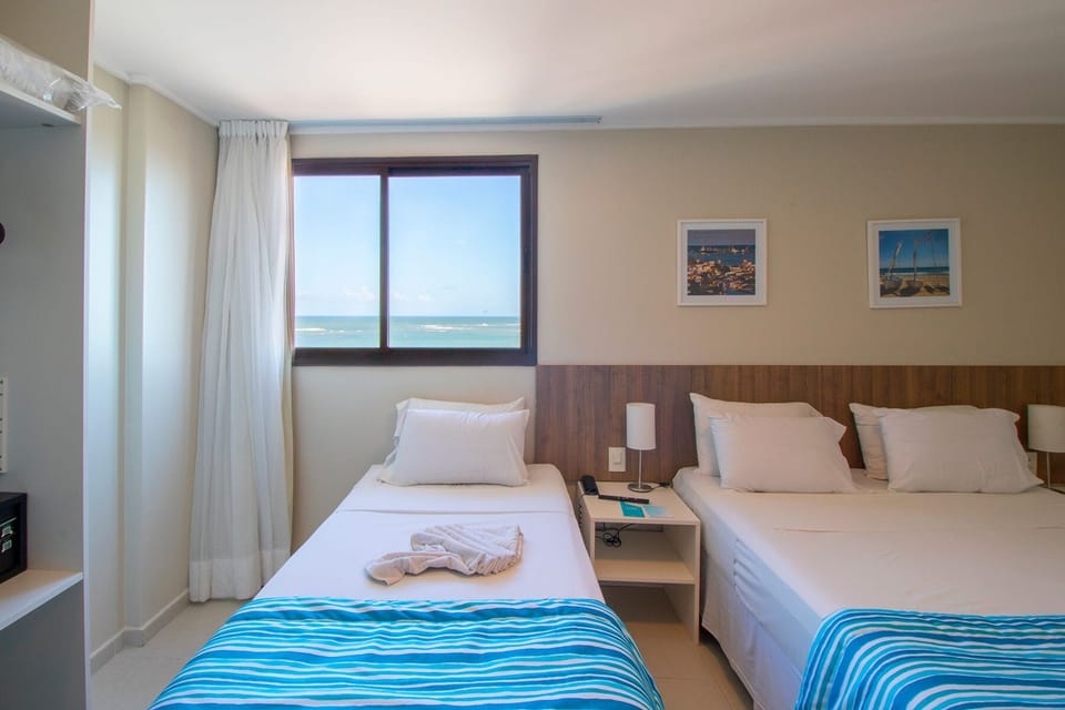 Premium Triple Room | Minibar, in-room safe, desk, free WiFi