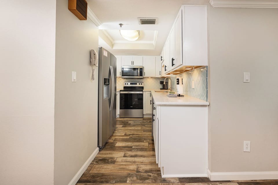 Craft delicious meals in the kitchen while soaking in the warm and inviting beach vibe all around you