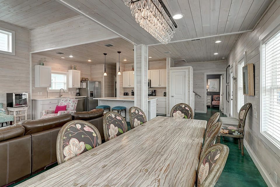 Your spacious open-concept living area seamlessly blends elegant dining with a gourmet kitchen, creating the perfect space for memorable meals together.
