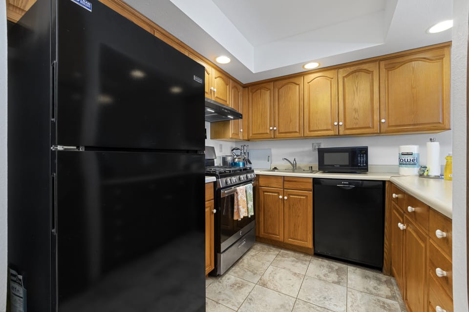 Your fully equipped kitchen has everything you need to prepare delicious homemade meals, with classic oak cabinetry, modern appliances, and generous counter space to make cooking feel effortless and enjoyable.
