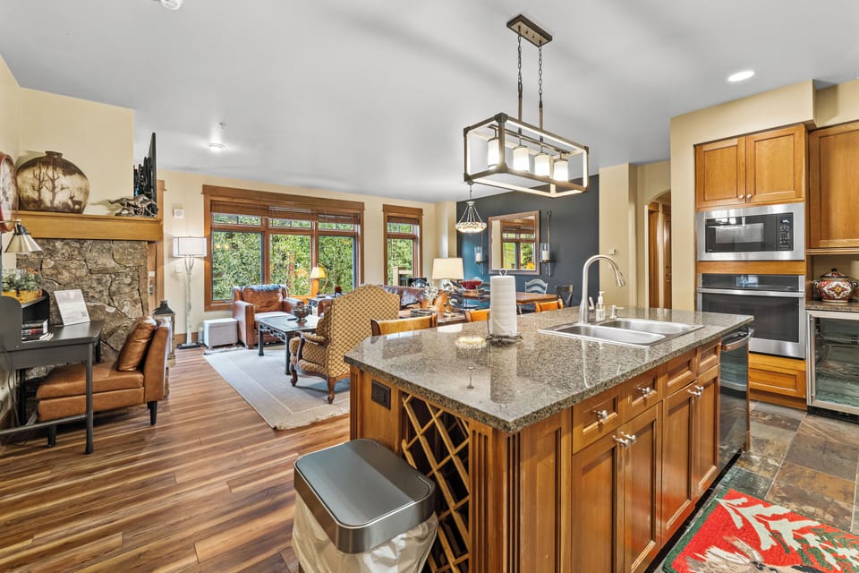 Cook together in this gourmet kitchen while friends gather around the granite island, then relax by the stone fireplace.