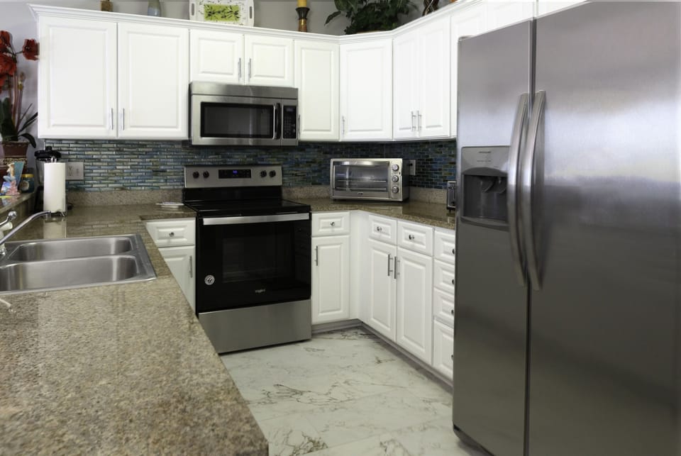 Open concept kitchen enjoy the view while cooking on upgraded SS appliances. 
