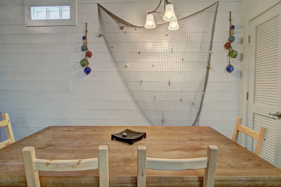 Dining area - Dining area with rustic beach-inspired décor for a true coastal dining experience