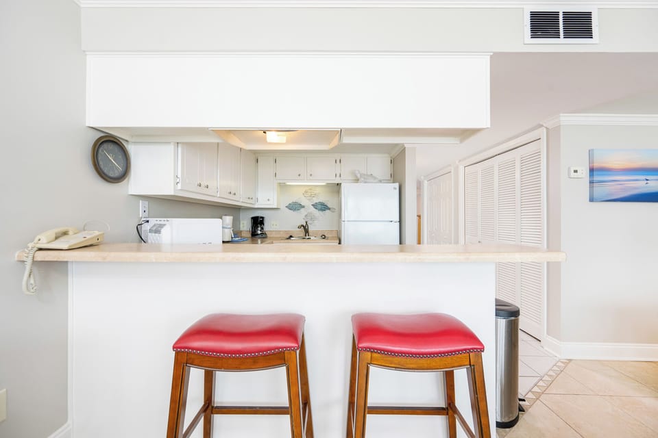 Sip your morning coffee at the bar stools, surrounded by the inviting beach vibe and aromas of your favorite brew