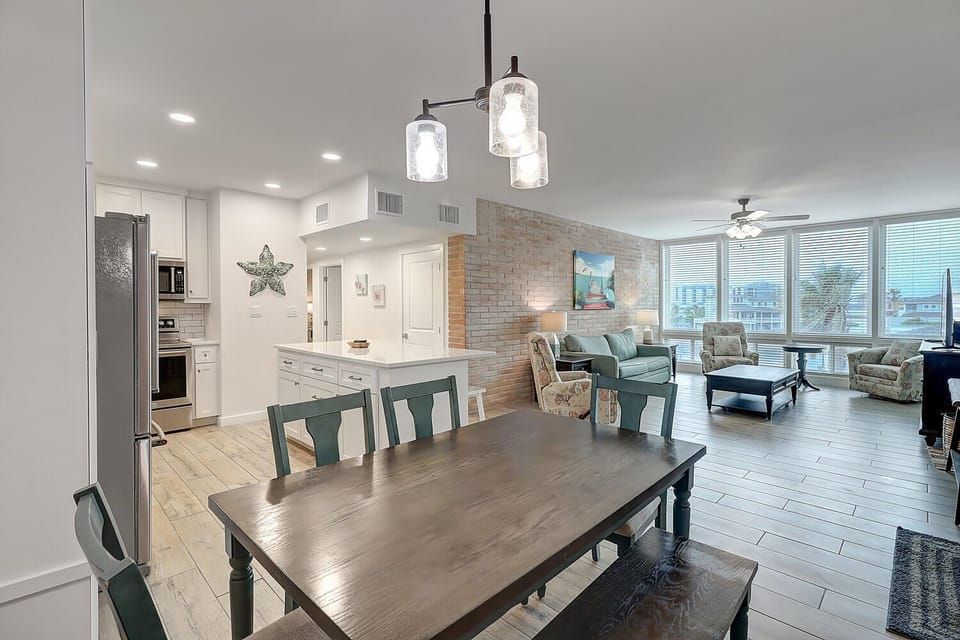 Step into your bright, open-concept retreat where the kitchen flows seamlessly into your dining and living spaces, perfect for gathering with loved ones.
