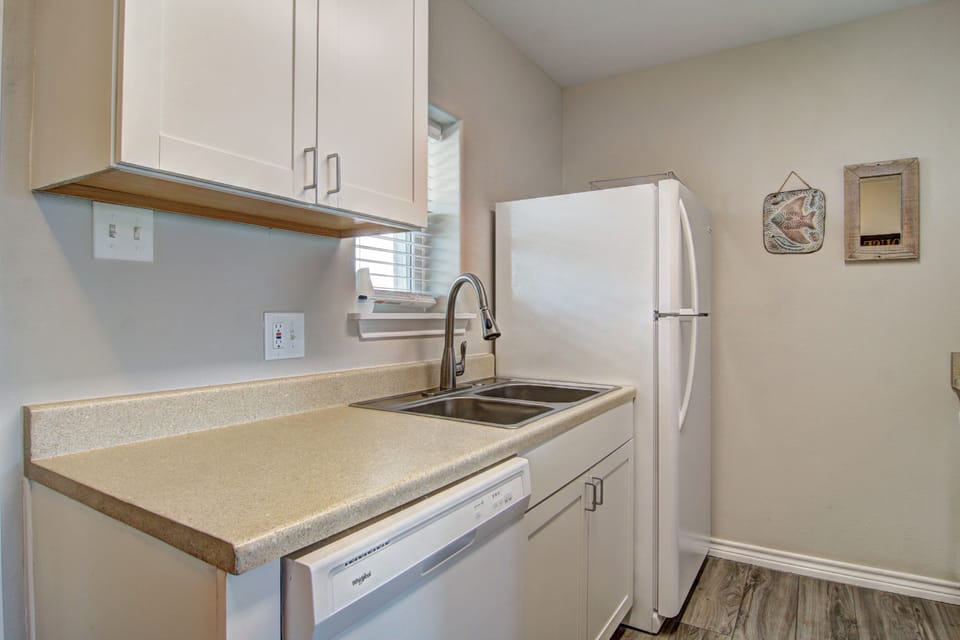 Your fully equipped kitchen features modern appliances and ample counter space for preparing meals during your stay.