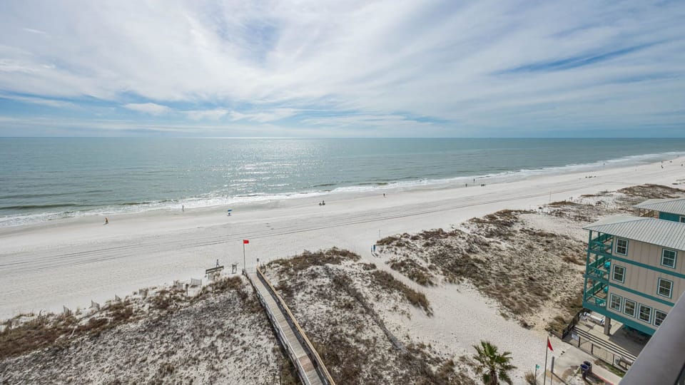 Gaze at the tranquil shoreline and relax with stunning views from your beachfront balcony