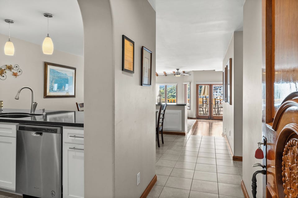 Step into your open-concept retreat where the modern kitchen flows seamlessly into bright living spaces, perfect for gathering and making memories.