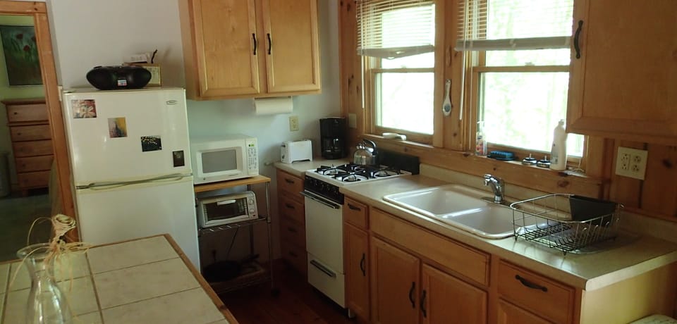 Compact but fully-stocked kitchen except for dishwasher...