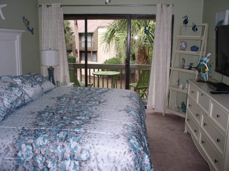 Second Floor Rear Bedroom (Mermaid Room) with View of Balcony. 