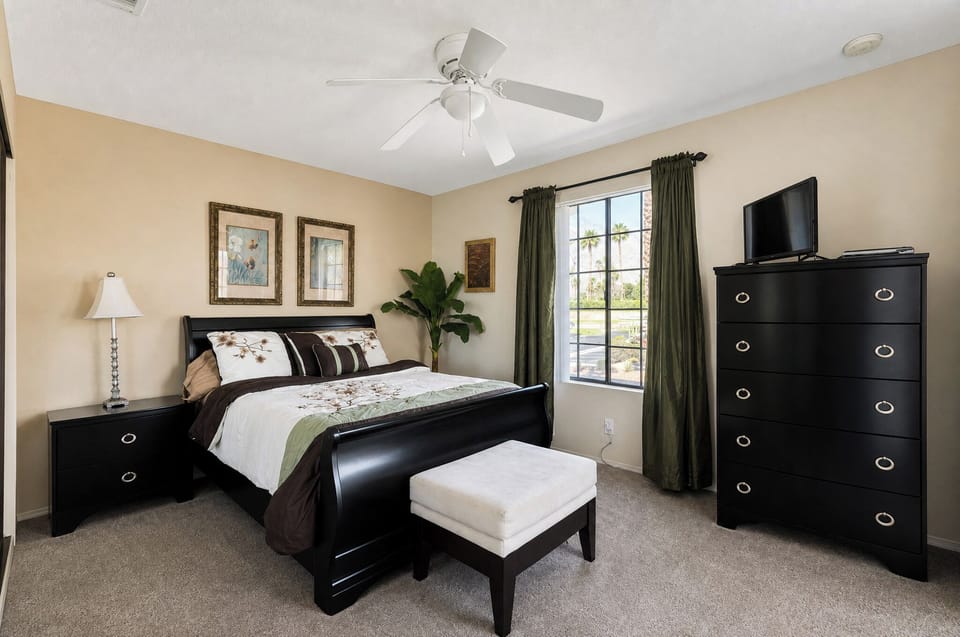Your serene bedroom retreat features a plush bed with elegant furnishings, soft lighting, and fresh greenery—perfect for unwinding after a day of adventure.
