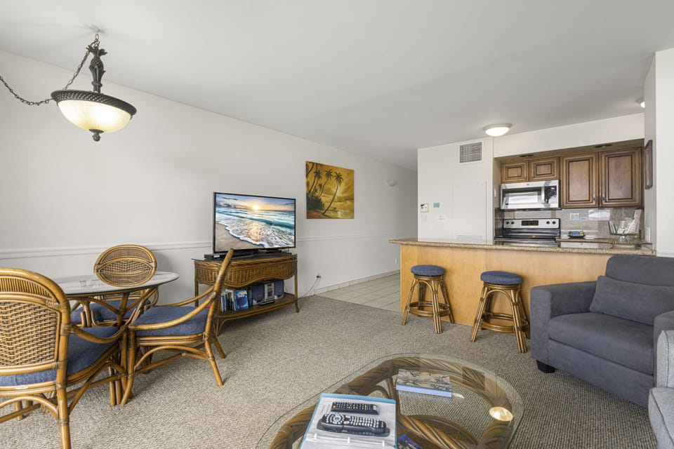 Settle into your breezy coastal retreat with a full kitchen, breakfast bar, and relaxed seating—where everything you need flows together in one open, inviting space.