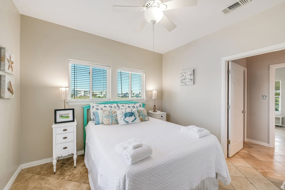 Drift off in your coastal-themed bedroom, where ocean-inspired decor and fresh linens create the perfect seaside retreat.