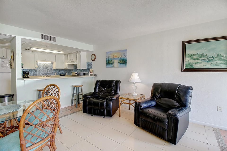 Relax in your comfortable leather recliners while enjoying the open-concept design connecting your living space to the fully-equipped kitchen.